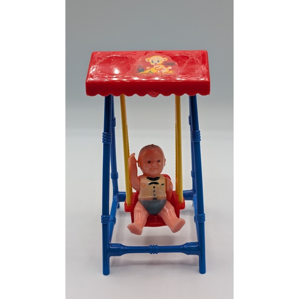 1951 Renwal dollhouse baby 5" swing with a plastic miniature 1" doll No. 19
